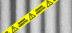 Asbestos, with hazard tape.