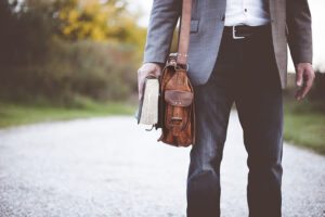 teacher with book and bag